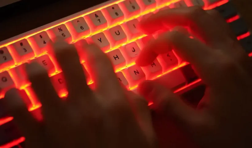 BERLIN, GERMANY - JANUARY 25: In this photo illustration a young man types on an illuminated computer keyboard typically favored by computer coders on January 25, 2021 in Berlin, Germany. (Photo by Sean Gallup/Getty Images)