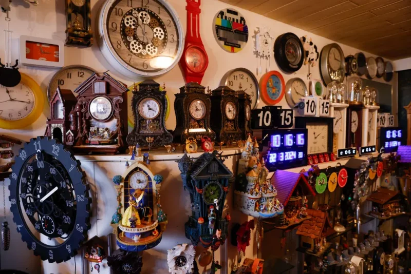 Werner Stechbarth poses inmid his collection of clocks in his living room in Munich, southern Germany, on March 22, 2024. Some 366 clocks cover the walls in the living room of 76-year-old Werner Stechbarth's apartment in Munich, the haul from a life spent criss-crossing the globe. The early year move to daylight saving time is a busy period for the pensioner, who takes it upon himself to adjust every one of his timepieces. (Photo by Michaela STACHE / AFP) / TO GO WITH AN AFP STORY BY Pauline CURTET (Photo by MICHAELA STACHE/AFP via Getty Images)