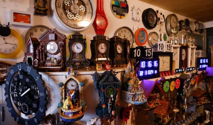 Werner Stechbarth poses inmid his collection of clocks in his living room in Munich, southern Germany, on March 22, 2024. Some 366 clocks cover the walls in the living room of 76-year-old Werner Stechbarth's apartment in Munich, the haul from a life spent criss-crossing the globe. The early year move to daylight saving time is a busy period for the pensioner, who takes it upon himself to adjust every one of his timepieces. (Photo by Michaela STACHE / AFP) / TO GO WITH AN AFP STORY BY Pauline CURTET (Photo by MICHAELA STACHE/AFP via Getty Images)