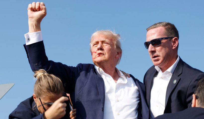 BUTLER, PENNSYLVANIA - JULY 13: Republican presidential candidate former President Donald Trump is rushed offstage during a rally on July 13, 2024 in Butler, Pennsylvania. Butler County district attorney Richard Goldinger said the shooter is dead after injuring former U.S. President Donald Trump, killing one audience member and injuring another in the shooting. (Photo by Anna Moneymaker/Getty Images)