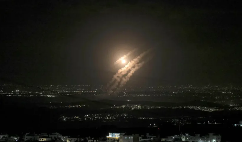 This picture taken from the West Bank city of Hebron shows projectiles above the Israeli city of Ashdod on October 1, 2024. Iran's Revolutionary Guards said a missile attack under way against Israel on October 1 was in response to the killing of Hezbollah chief Hassan Nasrallah last week as well as that of the Hamas leader. (Photo by HAZEM BADER / AFP) (Photo by HAZEM BADER/AFP via Getty Images)