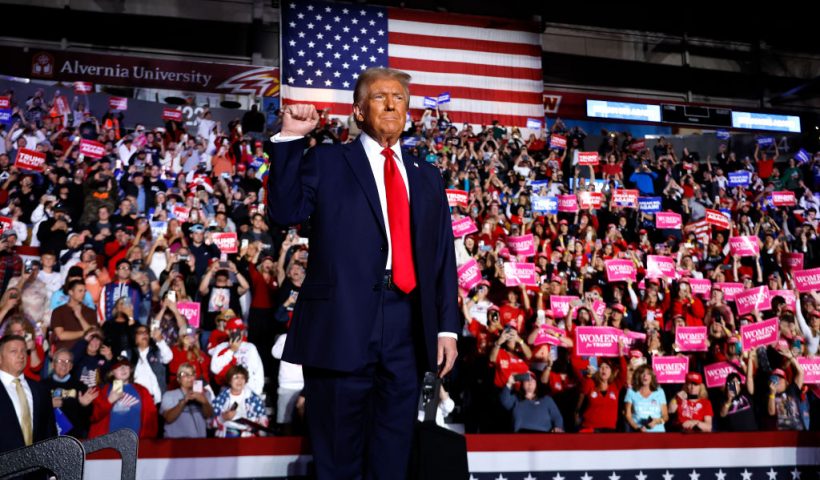 READING, PENNSYLVANIA - NOVEMBER 04: Republican presidential nominee, former President Donald Trump holds up a fist at a campaign rally at the Santander Arena on November 04, 2024 in Reading, Pennsylvania. With one day left before the general election, Trump is campaigning for re-election in the battleground states of North Carolina, Pennsylvania and Michigan. (Photo by Chip Somodevilla/Getty Images)