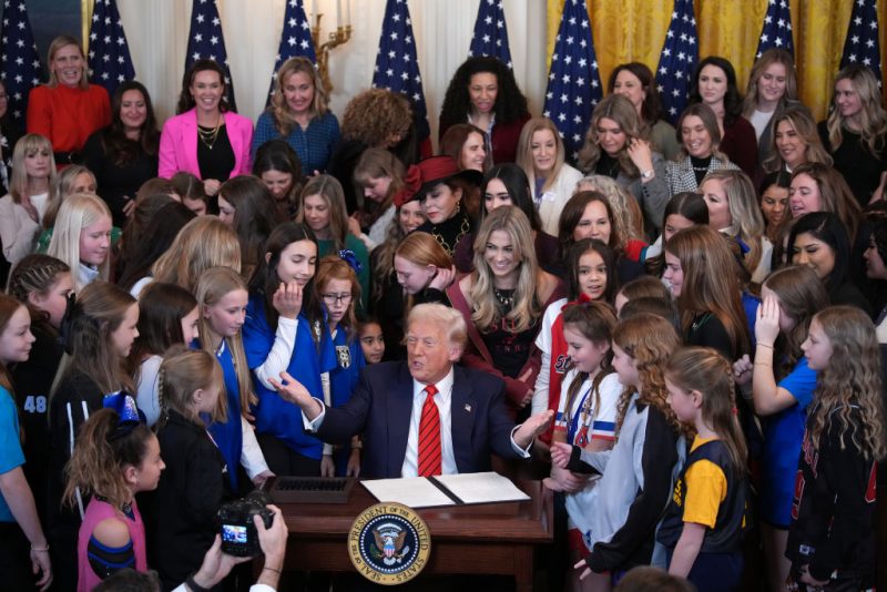 WASHINGTON, DC - FEBRUARY 05: U.S. President Donald Trump joined by women athletes signs the “No Men in Women’s Sports” executive order in the East Room at the White House on February 5, 2025 in Washington, DC. The executive order, which Trump signed on National Girls and Women in Sports Day, prohibits transgender women from competing in women’s sports and is the third order he has signed that targets transgender people. (Photo by Andrew Harnik/Getty Images)