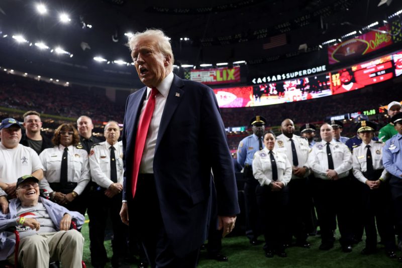 NEW ORLEANS, LOUISIANA - FEBRUARY 09: U.S. President Donald Trump reacts after posing with family members of victims in the January 1 attack on Bourbon Street and emergency responders prior to Super Bowl LIX between the Kansas City Chiefs and the Philadelphia Eagles at Caesars Superdome on February 09, 2025 in New Orleans, Louisiana. (Photo by Jamie Squire/Getty Images)