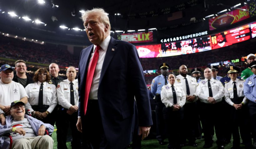 NEW ORLEANS, LOUISIANA - FEBRUARY 09: U.S. President Donald Trump reacts after posing with family members of victims in the January 1 attack on Bourbon Street and emergency responders prior to Super Bowl LIX between the Kansas City Chiefs and the Philadelphia Eagles at Caesars Superdome on February 09, 2025 in New Orleans, Louisiana. (Photo by Jamie Squire/Getty Images)