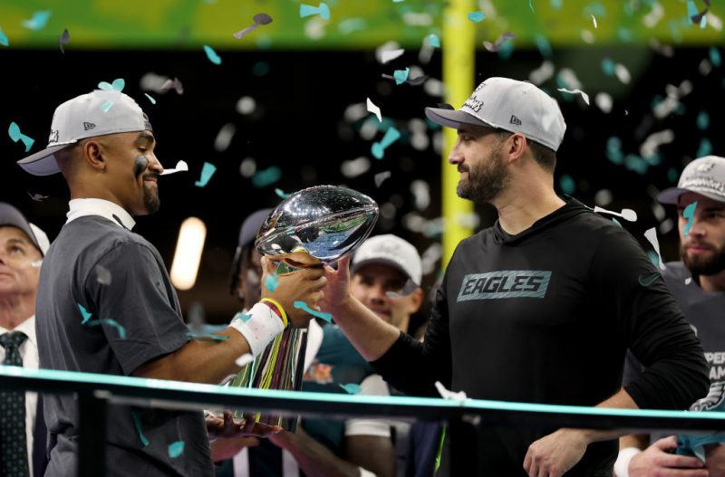 NEW ORLEANS, LOUISIANA - FEBRUARY 09: Jalen Hurts #1 of the Philadelphia Eagles hands the Vince Lombardi Trophy to head coach Nick Sirianni after beating the Kansas City Chiefs 40-22 to win Super Bowl LIX at Caesars Superdome on February 09, 2025 in New Orleans, Louisiana. (Photo by Jamie Squire/Getty Images)