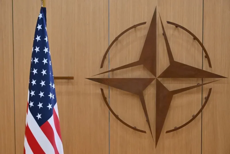 This photo shows the logo of the North Altantic Treaty Organisation (NATO) and the US flag prior to a meeting by the US special envoy for Ukraine and the NATO Secretary General, to address the ongoing war in Ukraine, at NATO headquarters in Brussels, on February 17, 2025. (Photo by NICOLAS TUCAT / POOL / AFP) (Photo by NICOLAS TUCAT/POOL/AFP via Getty Images)