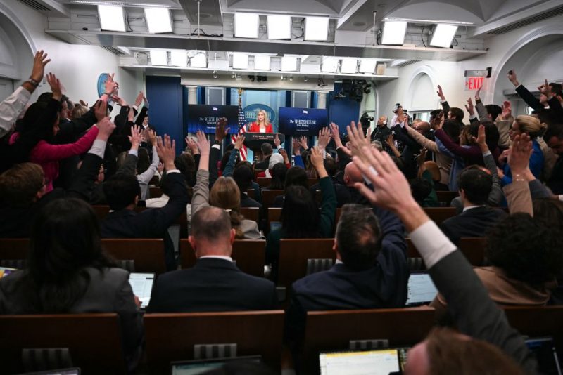 TOPSHOT - White House Press Secretary Karoline Leavitt (C) takes questions during the daily briefing in the Brady Briefing Room of the White House in Washington, DC, on February 25, 2025. (Photo by Jim WATSON / AFP) (Photo by JIM WATSON/AFP via Getty Images)