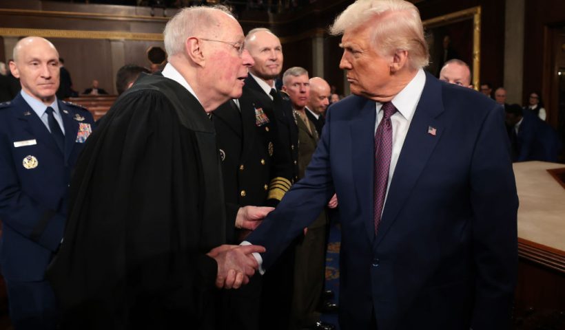 WASHINGTON, DC - MARCH 04: U.S. President Donald Trump shakes hands with retired Supreme Court Justice Anthony Kennedy after addressing a joint session of Congress at the U.S. Capitol on March 04, 2025 in Washington, DC. President Trump was expected to address Congress on his early achievements of his presidency and his upcoming legislative agenda. (Photo by Win McNamee/Getty Images)