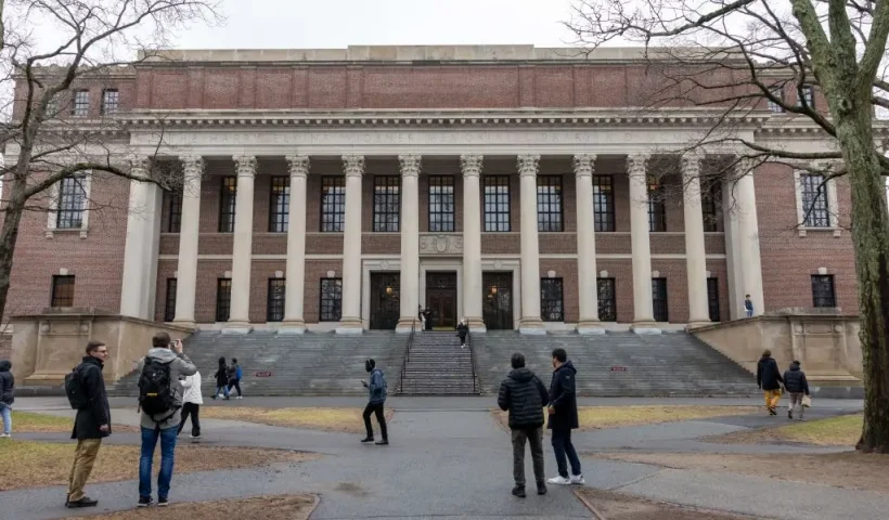 CAMBRIDGE, MASSACHUSETTS - MARCH 17: People gather outside Widener Library on Harvard University's campus on March 17, 2025 in Cambridge, Massachusetts. Harvard University announced free tuition for students from families that make under $200K a year. (Photo by Scott Eisen/Getty Images)