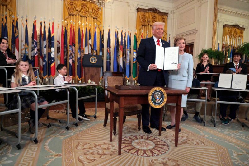 WASHINGTON, DC - MARCH 20: U.S. President Donald Trump stands with Secretary of Education Linda McMahon after signing an executive order to reduce the size and scope of the Education Department during a ceremony in the East Room of the White House on March 20, 2025 in Washington, DC. The order instructs McMahon, former head of the Small Business Administration and co-founder of the World Wrestling Entertainment, to shrink the $100 billion department, which cannot be dissolved without Congressional approval. (Photo by Chip Somodevilla/Getty Images)