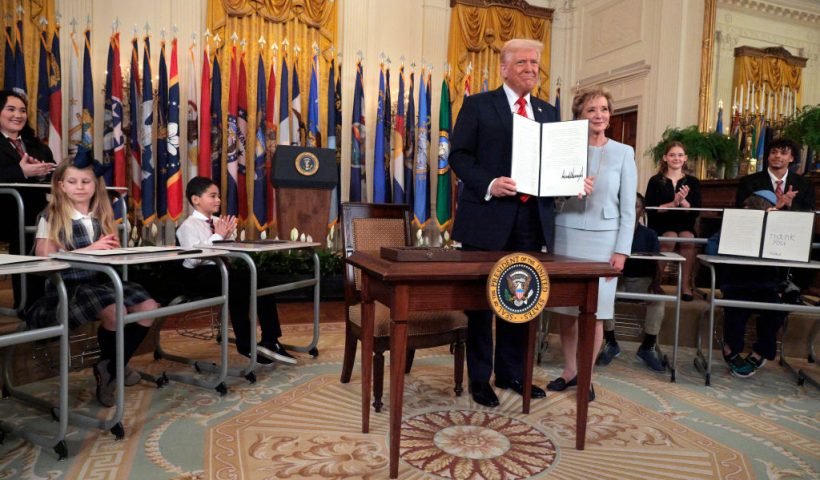 WASHINGTON, DC - MARCH 20: U.S. President Donald Trump stands with Secretary of Education Linda McMahon after signing an executive order to reduce the size and scope of the Education Department during a ceremony in the East Room of the White House on March 20, 2025 in Washington, DC. The order instructs McMahon, former head of the Small Business Administration and co-founder of the World Wrestling Entertainment, to shrink the $100 billion department, which cannot be dissolved without Congressional approval. (Photo by Chip Somodevilla/Getty Images)