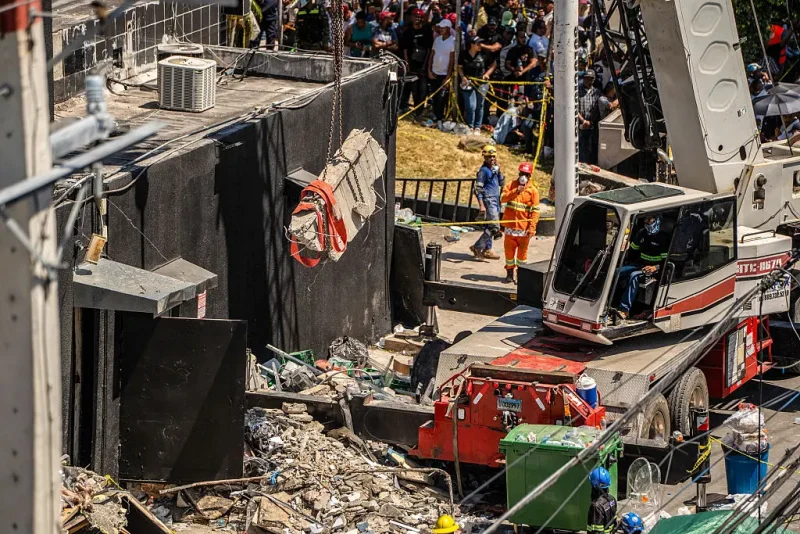 Personnel from civil defense and firefighters work at the Jet Set nightclub following the collapse of its roof in Santo Domingo on April 8, 2025. Rescuers raced to find survivors Tuesday among the rubble of a Dominican Republic night club where at least 44 people died and dozens were hurt in an early-morning roof collapse. (Photo by Francesco SPOTORNO / AFP) (Photo by FRANCESCO SPOTORNO/AFP via Getty Images)