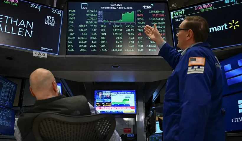 Traders work on the floor of the New York Stock Exchange (NYSE) during afternoon trading on April 9, 2025 in New York. Wall Street stocks rocketed to close solidly higher Wednesday, with dramatic advances on all three major indexes as US President Donald Trump delayed steep new tariffs hours after they took effect. The Dow Jones Industrial Average surged 7.9 percent to 40,608.45, the broad-based S&P 500 Index rallied 9.5 percent to 5,456.90, and the tech-focused Nasdaq Composite Index jumped more than 12.2 percent to 17,124.97. (Photo by ANGELA WEISS / AFP) (Photo by ANGELA WEISS/AFP via Getty Images)