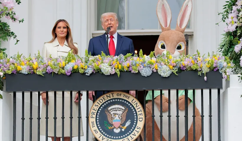 WASHINGTON, DC - APRIL 21: U.S. President Donald Trump, joined by first lady Melania Trump and the Easter Bunny, delivers remarks during the White House Egg Roll on the South Lawn of the White House on April 21, 2025 in Washington, DC. The White House is expecting thousands of children and adults to participate in the annual tradition of rolling colored eggs down the White House lawn, which was started by President Rutherford B. Hayes in 1878. (Photo by Anna Moneymaker/Getty Images)