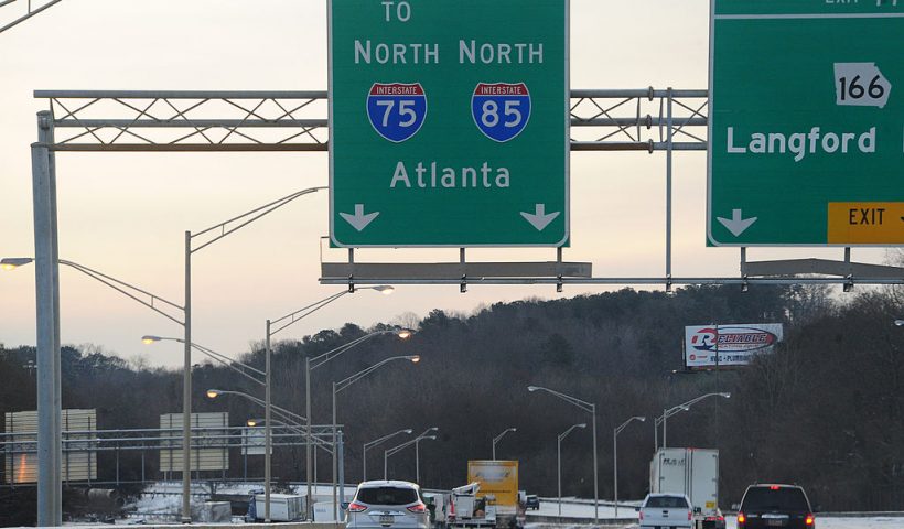 ATLANTA, GA - JANUARY 29: Cars drive along Interstate 75 in icy conditions January 29, 2014 in Atlanta, Georgia. Thousands of motorists were stranded, many overnight, as a winter storm dropped three inches of snow, and ice made driving hazardous. (Photo by Scott Cunninghaml/Getty Images)
