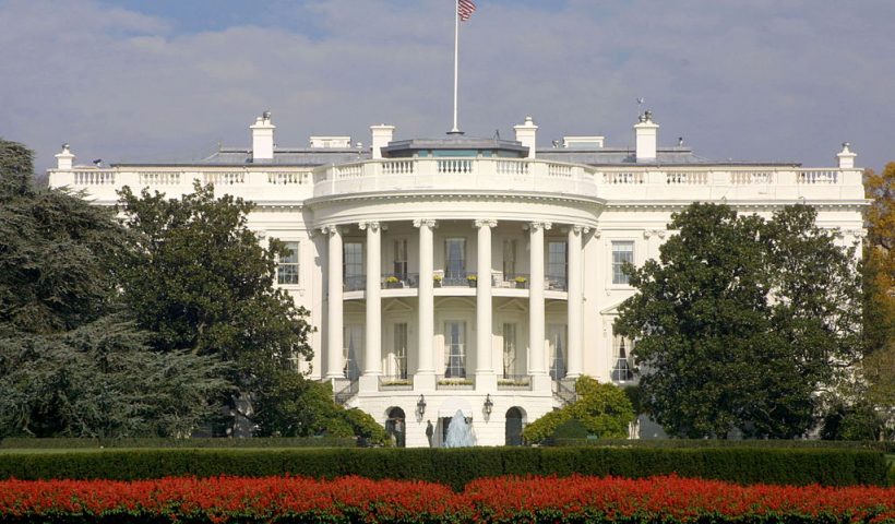 381943 04: FILE PHOTO: A flag flies atop the White House November 15, 2000 in Washington, DC. It has been reported February 7, 2001 that a man, identified as a 17 year old and later described as a white male in his forties, was shot in the leg outside the White House grounds by security personnel. The subject who was reportedly carrying a gun, was a possible suicide attempt, as well as, a threat to the well being of White House personnel. (Photo by Alex Wong/Newsmakers)