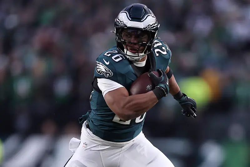 Philadelphia Eagles running back Saquon Barkley (26) rushes the ball against the Green Bay Packers during the first quarter in the NFC wild card game at Lincoln Financial Field. Mandatory Credit: Bill Streicher-Imagn Images