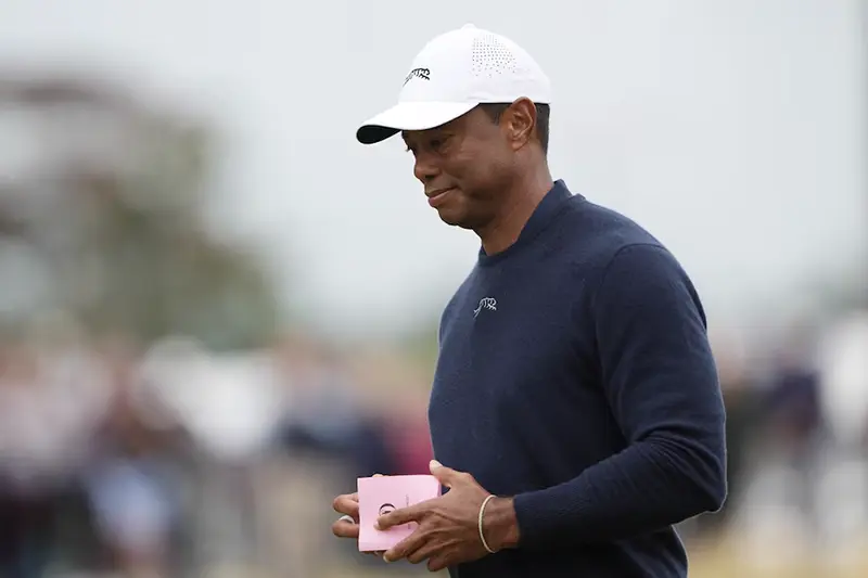 Tiger Woods of the U.S. at the 18th green after finishing his second round REUTERS/Maja Smiejkowska/File Photo