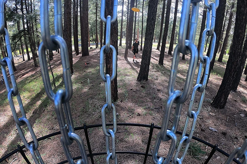 FLAGSTAFF, ARIZONA - JUNE 04: Eric Aguirre competes in the Highlander Classic putting competition at the Fort Tuthill Disc Golf Course on June 04, 2022 in Flagstaff, Arizona. Disc golf is one of the fastest growing sports in America, with a 33% increase in games played from 2019 to 2020 alone. (Photo by Christian Petersen/Getty Images)