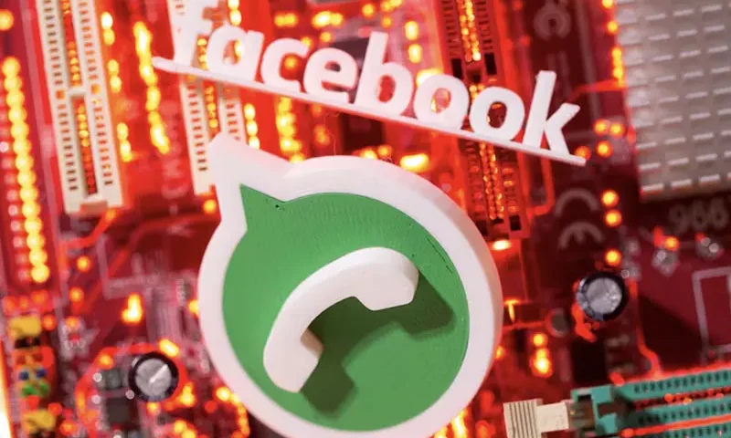 3D printed Whatsapp and Facebook logos are placed on a computer motherboard in this illustration taken January 21, 2021. REUTERS/Dado Ruvic/Illustration