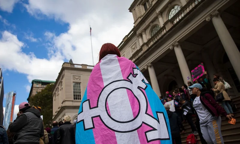 NEW YORK, NY - OCTOBER 24: L.G.B.T. activists and their supporters rally in support of transgender people on the steps of New York City Hall, October 24, 2018 in New York City. The group gathered to speak out against the Trump administration's stance toward transgender people. Last week, The New York Times reported on an unreleased administration memo that proposes a strict biological definition of gender based on a person's genitalia at birth. (Photo by Drew Angerer/Getty Images)