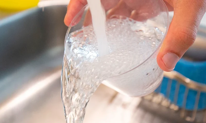 Tap water is seen in this photo illustration in Washington, DC, on August 19, 2019. - A study published on August 19, 2019 links exposure to fluoridated tap water during pregnancy to lower IQ scores in infants, but several outside experts expressed concern over its methodology and questioned its findings. Fluoride has been added to community water supplies in industrial countries to prevent tooth decay since the 1950s. Very high levels of the mineral have been found to be toxic to the brain, though the concentrations seen in fluoridated tap water are generally deemed safe. (Photo by Alastair Pike / AFP) (Photo credit should read ALASTAIR PIKE/AFP via Getty Images)