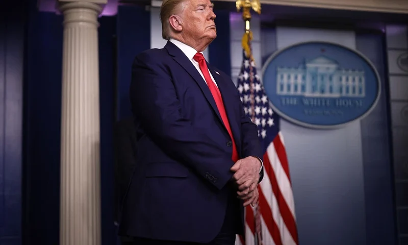 U.S. President Donald Trump listens to speakers in the press briefing room with members of the White House Coronavirus Task Force April 3, 2020 in Washington, DC. President Trump announced that Americans in virus hot spots should wear a mask when out in public as the death rate caused by coronavirus has nearly doubled in three days in New York City while the nation continues to reel from the impacts of COVID-19. (Photo by Win McNamee/Getty Images)