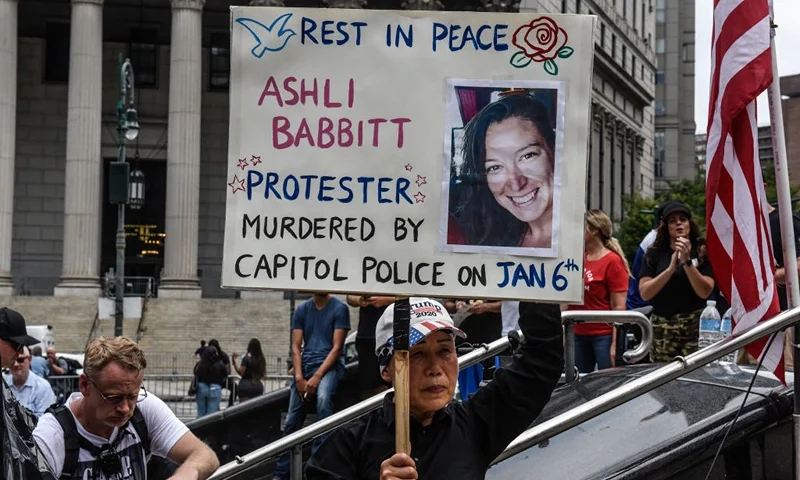 NEW YORK, NY - JULY 25: A right wing protester holds a sign about Ashli Babbitt while participating in a political rally on July 25, 2021 in New York City. Protesters were demanding a release of the people who were arrested on January 6th for their involvement in the breach of the Capitol building. (Photo by Stephanie Keith/Getty Images)