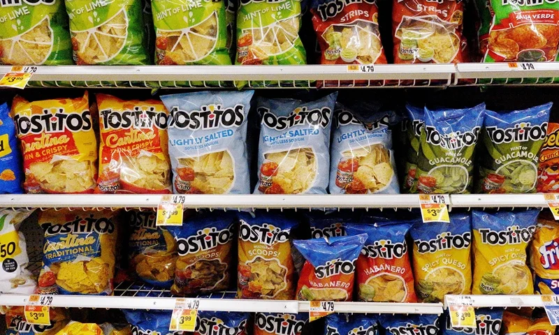 Bags of Tostitos tortilla chips are on display on a supermarket shelf on October 15, 2021, in Arlington, Virginia. (Photo by Olivier DOULIERY / AFP) (Photo by OLIVIER DOULIERY/AFP via Getty Images)