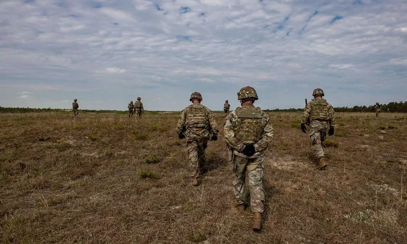 Officers watch as members of the 182d Infantry Regiment work in concert as small squads and fire on targets in a field as they train for deployment to the Middle East during live fire weapons training at US Fort Dix in New Jersey on May 16, 2022. - The unit is training to deploy to the Middle East. The 182nd Infantry Regiment, part of the US Army National Guard, is among the oldest in the US and dates pack to pre-US history as part of the colonial militias for England organized in 1636, joining the US in 1776 with the US Revolution. Its now part of the Massachusetts National Guard. (Photo by Joseph Prezioso / AFP) (Photo by JOSEPH PREZIOSO/AFP via Getty Images)