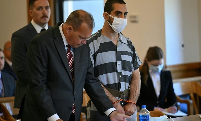 TOPSHOT - Hadi Matar, the man accused in the attempted murder of British author Salman Rushdie, appears in court for a procedural hearing at Chautauqua County Courthouse in Mayville, New York on August 18, 2022. - Matar has pleaded not guilty to attempted murder charges after being accused of stabbing British author Salman Rushdie multiple times on stage during a literary event at the Chautauqua Institution. The severely injured author is recovering and showing signs of his "feisty and defiant" self, family and friends said, after the shocking assault left him on a ventilator with multiple stab wounds on August 12, 2022. (Photo by ANGELA WEISS / AFP) (Photo by ANGELA WEISS/AFP via Getty Images)