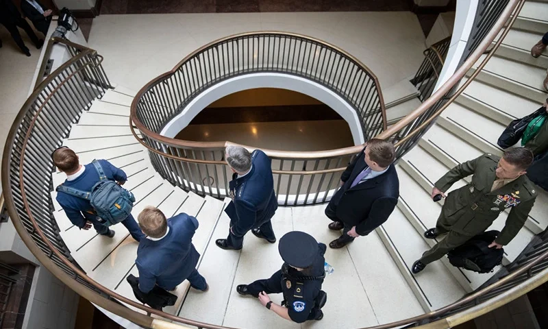 At center, General Glen VanHerck, Commander of U.S. Northern Command and North American Aerospace Defense Command, walks with security and military officials as he arrives for a closed-door briefing for Senators about the Chinese spy balloon at the U.S. Capitol February 9, 2023 in Washington, DC. Military and administration officials are briefing both houses of Congress today about the U.S. response to China's use of a spy balloon in American airspace. (Photo by Drew Angerer/Getty Images)