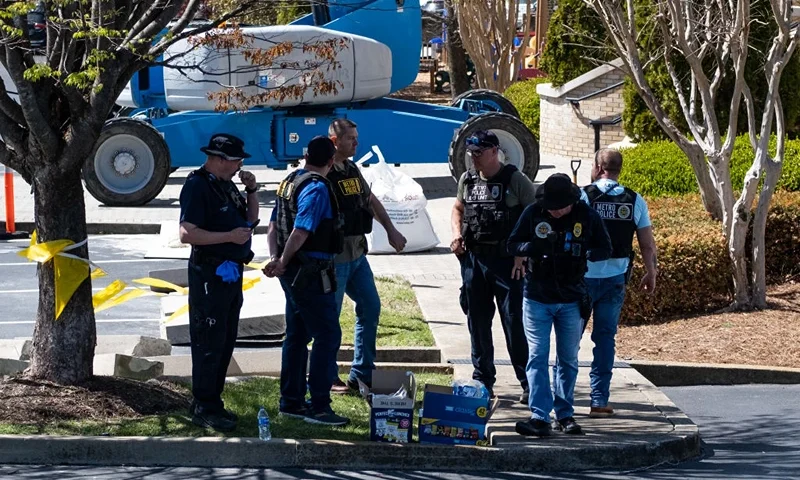 NASHVILLE, TN - MARCH 27: Law enforcement officers stand outside of Woodmont Baptist Church while waiting for children to be reunited with their families after a mass shooting at The Covenant School on March 27, 2023 in Nashville, Tennessee. According to initial reports, three students and three adults were killed by the shooter, a 28-year-old woman. The shooter was killed by police responding to the scene. (Photo by Seth Herald/Getty Images)