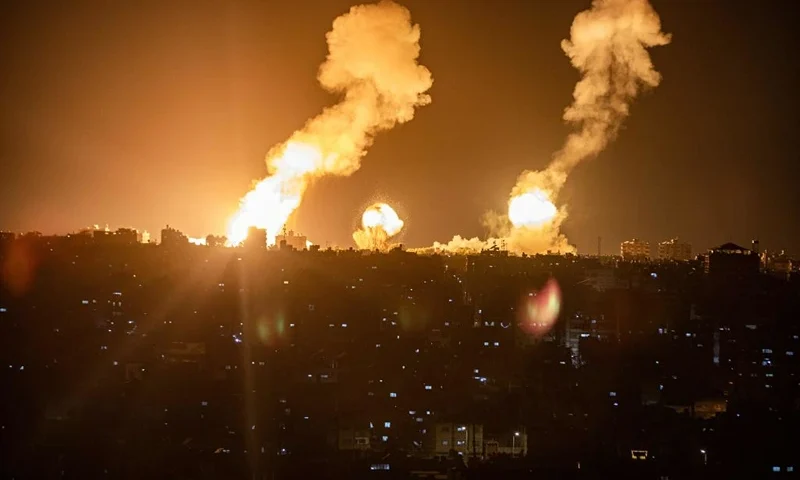 This picture taken early on April 7, 2023 shows explosions in Khan Yunis in the southern Gaza Strip during Israeli air strikes on the Palestinian enclave. (Photo by Yousef MASOUD / AFP) (Photo by YOUSEF MASOUD/AFP via Getty Images)