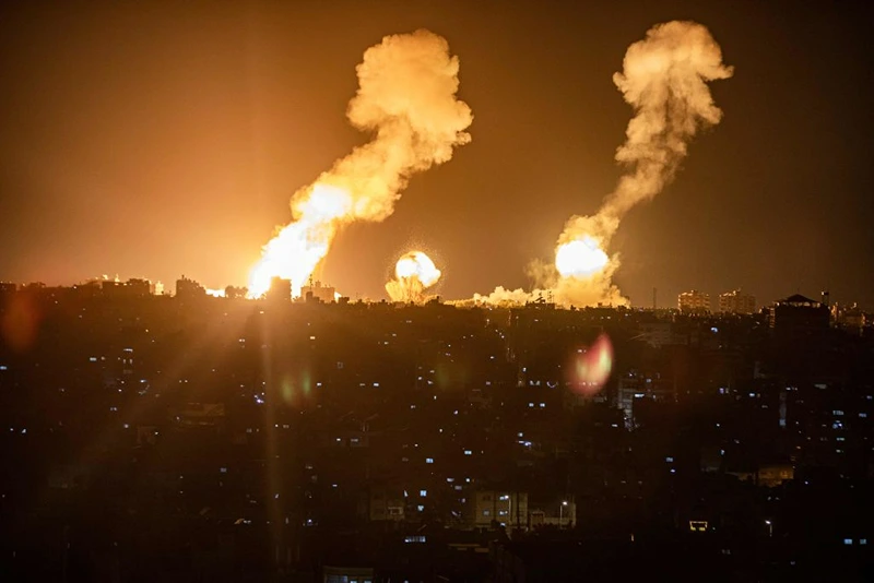 This picture taken early on April 7, 2023 shows explosions in Khan Yunis in the southern Gaza Strip during Israeli air strikes on the Palestinian enclave. (Photo by Yousef MASOUD / AFP) (Photo by YOUSEF MASOUD/AFP via Getty Images)