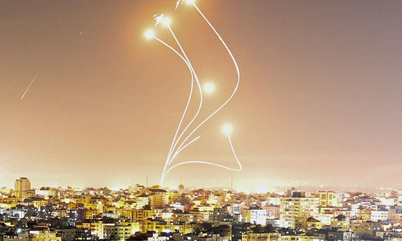 Israel's Iron Dome air defence system intercepts rockets launched from Gaza City, on May 10, 2023. Israel's army and Gaza militants traded heavy cross-border fire on May 10, with 22 Palestinians killed over two days amid the worst escalation of violence to hit the coastal territory in months. (Photo by MAHMUD HAMS / AFP) (Photo by MAHMUD HAMS/AFP via Getty Images)