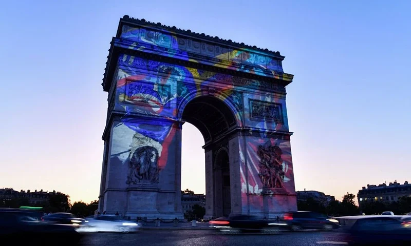 A rugby illustration is projected on Arc de Triomphe to mark 100 days before the start of the France 2023 Rugby World Cup, in Paris, on May 31, 2023. (Photo by JULIEN DE ROSA / AFP) (Photo by JULIEN DE ROSA/AFP via Getty Images)