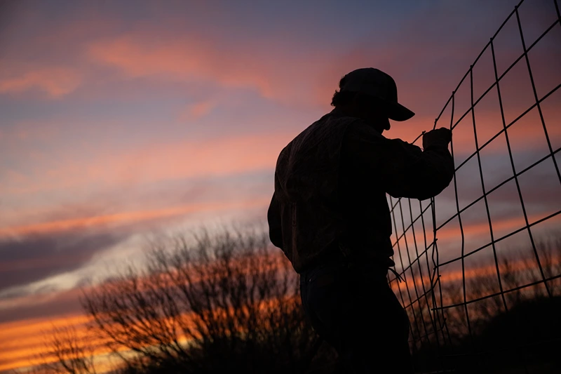 QUEMADO, TEXAS - FEBRUARY 22: Farmer Randy Edwards, 64, fixes a broken barn fence on February 23, 2023 in Quemado, Texas. The valley's dry spell continues creating financial challenges for the Edwards' as demand climbs and resources become increasingly scarce due to a lack of rainfall in the region. "Cindy has already used her year's budget on hay for her lambs, and its only February. We're now supplementing with hay because the fields aren't producing-which is costly," said Edwards. Agriculture and livelihood along the Rio Grande is undergoing severe drought conditions as record-high dry spells continue straining the region. An increasingly arid climate and a growing population along the Southern border has signified and raised concerns on the severity, regularity and duration of naturally occurring droughts in the region. (Photo by Brandon Bell/Getty Images)