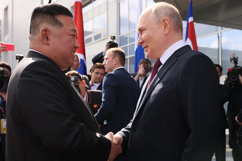 TOPSHOT - In this pool photo distributed by Sputnik agency, Russia's President Vladimir Putin (R) shakes hands with North Korea's leader Kim Jong Un (L) during their meeting at the Vostochny Cosmodrome in Amur region on September 13, 2023. Russian President Vladimir Putin and North Korean leader Kim Jong Un both arrived at the Vostochny Cosmodrome in Russia's Far East, Russian news agencies reported on September 13, ahead of planned talks that could lead to a weapons deal. (Photo by Mikhail METZEL / POOL / AFP) (Photo by MIKHAIL METZEL/POOL/AFP via Getty Images)