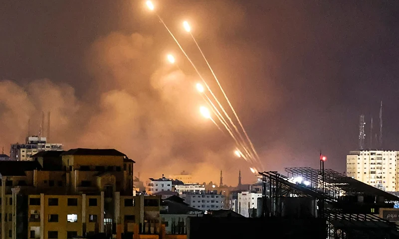 EDITORS NOTE: Graphic content / A salvo of rockets is fired by Palestinian militants from Gaza City toward Israel, on October 8, 2023. The death toll surged to almost 1,000 since Palestinian militant group Hamas launched its massive surprise attack on Israel with a barrage of rockets and a massive ground assault, officials on both sides said on October 8. (Photo by MOHAMMED ABED / AFP) (Photo by MOHAMMED ABED/AFP via Getty Images)