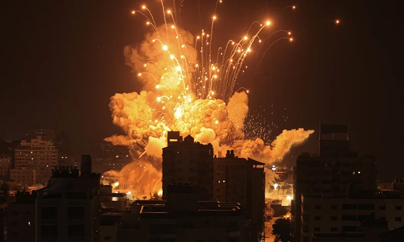 A missile explodes in Gaza City during an Israeli air strike on October 8, 2023. srael, reeling from the deadliest attack on its territory in half a century, formally declared war on Hamas Sunday as the conflict's death toll surged close to 1,000 after the Palestinian militant group launched a massive surprise assault from Gaza. (Photo by MAHMUD HAMS / AFP) (Photo by MAHMUD HAMS/AFP via Getty Images)