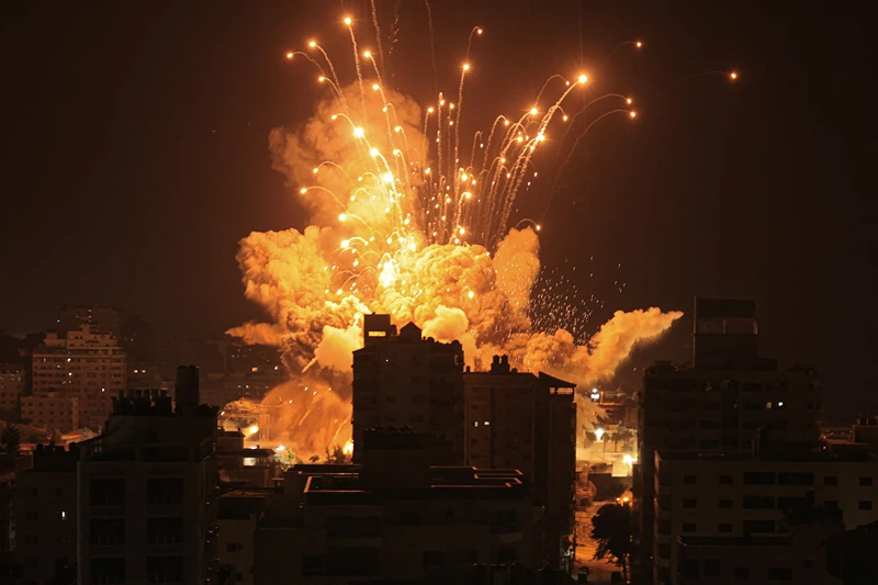 A missile explodes in Gaza City during an Israeli air strike on October 8, 2023. srael, reeling from the deadliest attack on its territory in half a century, formally declared war on Hamas Sunday as the conflict's death toll surged close to 1,000 after the Palestinian militant group launched a massive surprise assault from Gaza. (Photo by MAHMUD HAMS / AFP) (Photo by MAHMUD HAMS/AFP via Getty Images)
