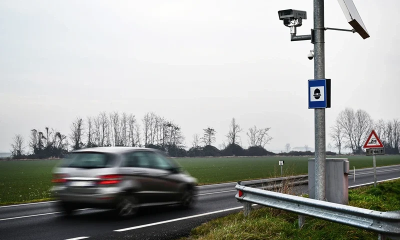 A car rides past a speed camera on January 26, 2024 on a road of Lagnasco, northwestern Italy. Hailed by exasperated motorists or condemned as a vigilante who risks lives, a saboteur known as "Fleximan" has been destroying speed cameras across northern Italy, sparking a national debate. (Photo by Marco Bertorello / AFP) (Photo by MARCO BERTORELLO/AFP via Getty Images)