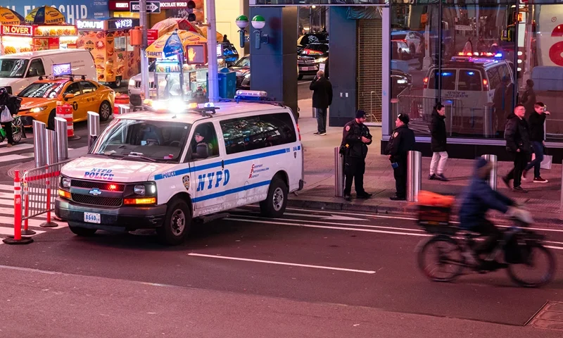 NEW YORK, NEW YORK - FEBRUARY 06: Police patrol in Times Square on February 06, 2024 in New York City. Seven migrants were arrested, including several Monday morning in an NYPD raid in the Bronx, which targeted a gang that was using scooters to snatch mobile phones, bags, and wallets from pedestrians. The arrests come after the release of a surveillance video that shows several migrant men kicking officers on a sidewalk and trying to pry them off a man police had taken to the ground. The recent incidents involving migrants, which now number over 150,000 in New York City, has increased tensions in New York which is struggling to house and pay for the recent arrivals. (Photo by Spencer Platt/Getty Images)