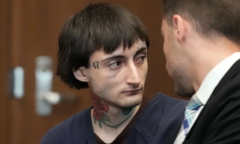 Robert E. Crimo III speaks to Lake County's assistant public defender Anton Trizna as he appears for a hearing before Judge Victoria A. Rossetti at the Lake County Courthouse on June 26, 2024 in Waukegan, Illinois. Crimo III is charged with killing seven people and wounding dozens more in a shooting at July 4th parade in the suburban Chicago town of Highland Park in 2022. (Photo by Nam Y. Huh-Pool/Getty Images)