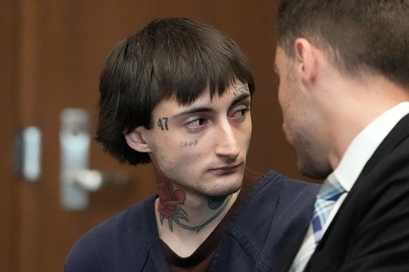 Robert E. Crimo III speaks to Lake County's assistant public defender Anton Trizna as he appears for a hearing before Judge Victoria A. Rossetti at the Lake County Courthouse on June 26, 2024 in Waukegan, Illinois. Crimo III is charged with killing seven people and wounding dozens more in a shooting at July 4th parade in the suburban Chicago town of Highland Park in 2022. (Photo by Nam Y. Huh-Pool/Getty Images)