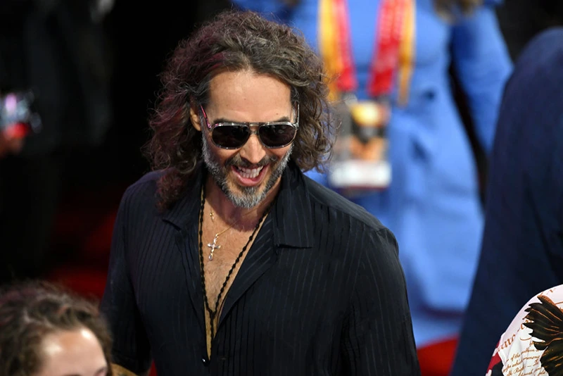 MILWAUKEE, WISCONSIN - JULY 18: Comedian and actor Russell Brand attends the fourth day of the Republican National Convention at the Fiserv Forum on July 18, 2024 in Milwaukee, Wisconsin. Delegates, politicians, and the Republican faithful are in Milwaukee for the annual convention, concluding with former President Donald Trump accepting his party's presidential nomination. The RNC takes place from July 15-18. (Photo by Leon Neal/Getty Images)