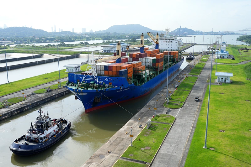A cargo ship and tugboat sail through the Cocoli Locks at the Panama Canal, in Panama, on August 12, 2024. Next August 15 the Panama Canal celebrates its 110th inauguration anniversary. (Photo by ARNULFO FRANCO / AFP) (Photo by ARNULFO FRANCO/AFP via Getty Images)