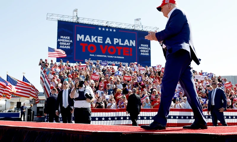 WILMINGTON, NORTH CAROLINA - SEPTEMBER 21: Republican presidential candidate former U.S. President Donald Trump walks offstage after speaking at a campaign rally at the Aero Center Wilmington on September 21, 2024 in Wilmington, North Carolina. Trump is returning to Wilmington, North Carolina after his previous scheduled rally in April was canceled because of a thunderstorm. (Photo by Anna Moneymaker/Getty Images)